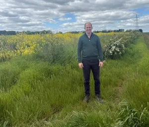 Michael Woolhouse in a field with multiple nature-friendly measures.