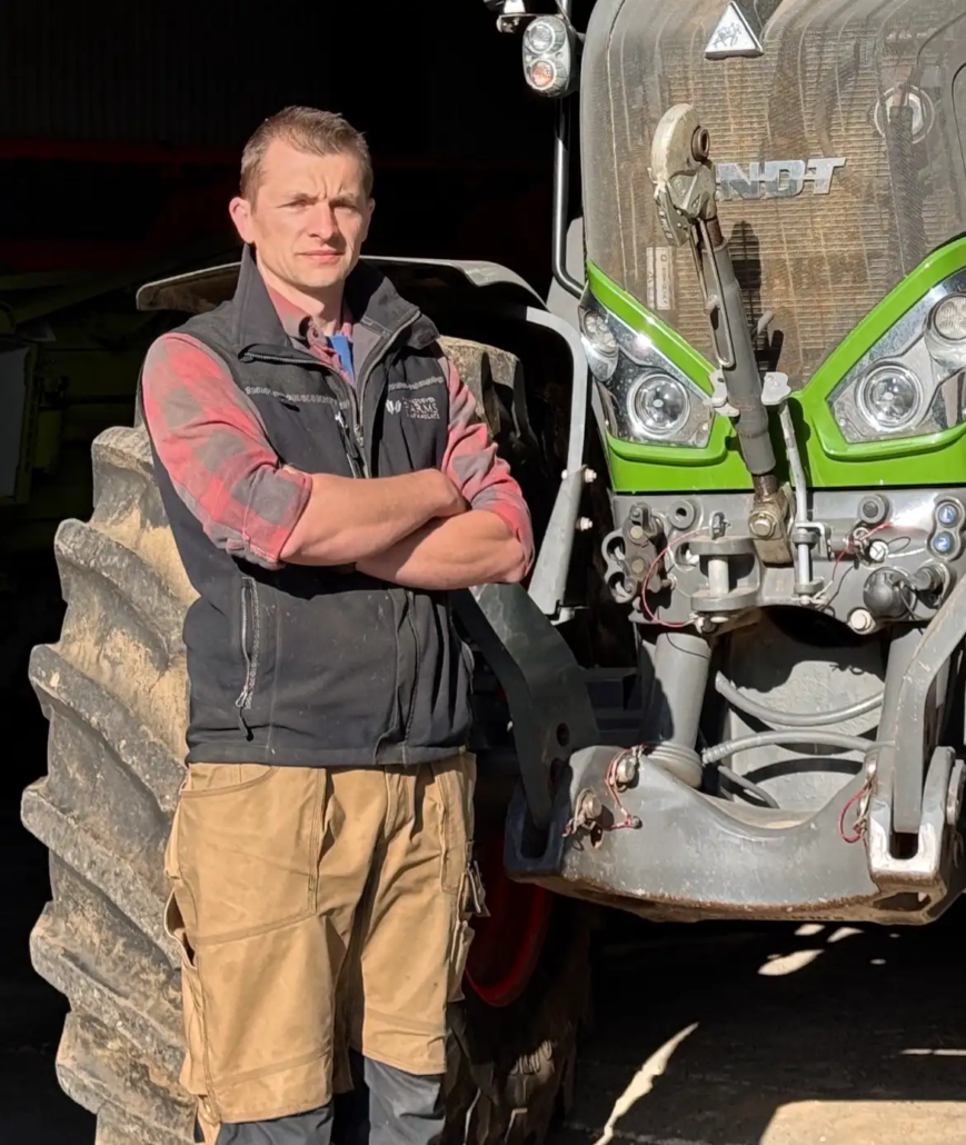 Richard Maddever standing next to a tractor