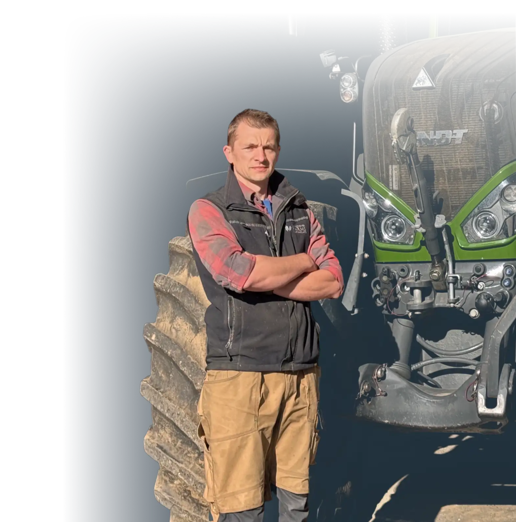 Richard Maddever standing next to a tractor